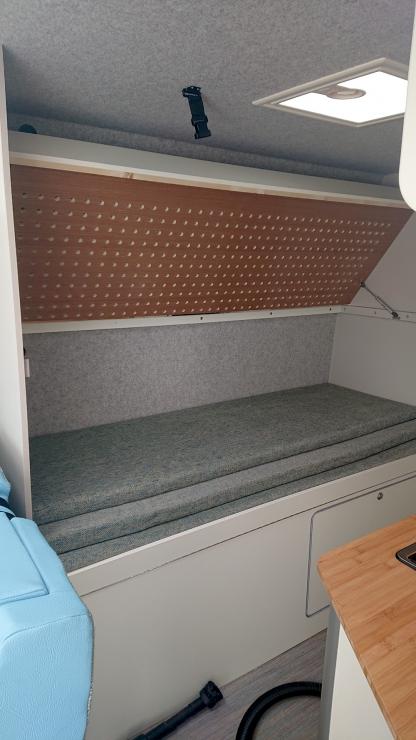 Top bunk folds up to allow seating on the bottom bunk. Check out the cnc cut holes to let the mattress breath