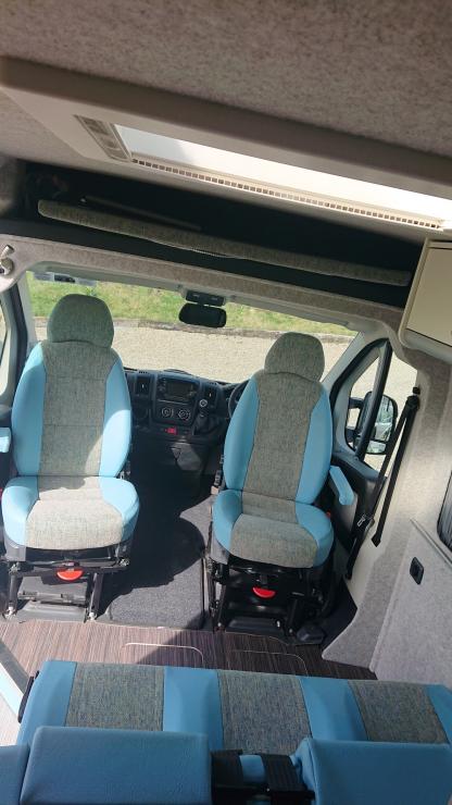 Front swivel seats re-upholstered in soft weave and vinyl fabrics
