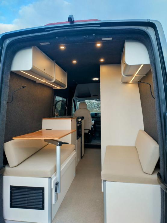 rear seating with table that converts to a double bed